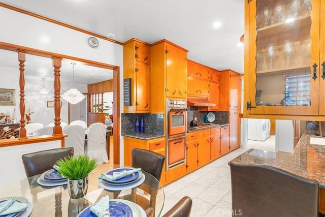 kitchen featuring decorative backsplash and appliances with stainless steel finishes