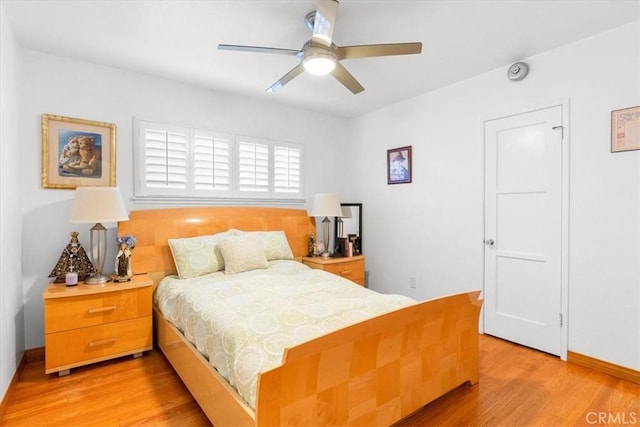 bedroom with light wood-type flooring and ceiling fan