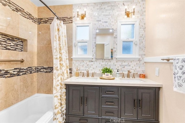 bathroom with vanity, backsplash, and shower / bath combo