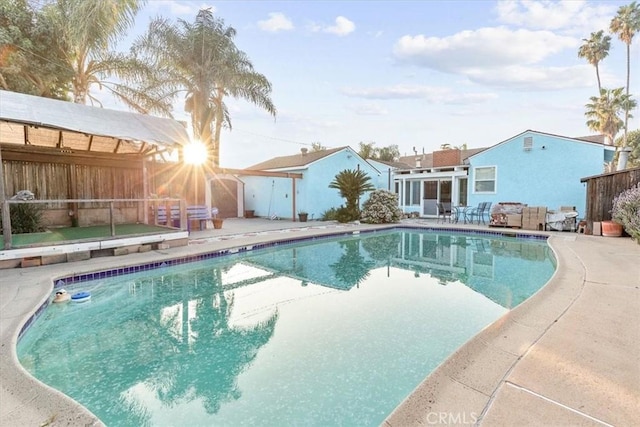 view of swimming pool with a patio