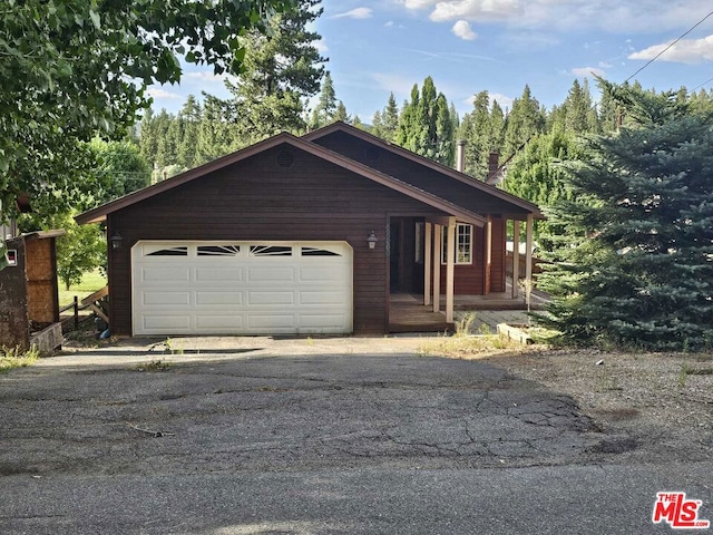 ranch-style home featuring a garage