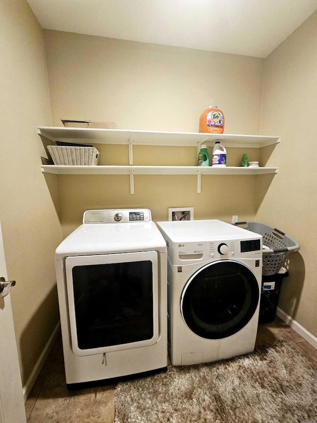 laundry room with washing machine and clothes dryer