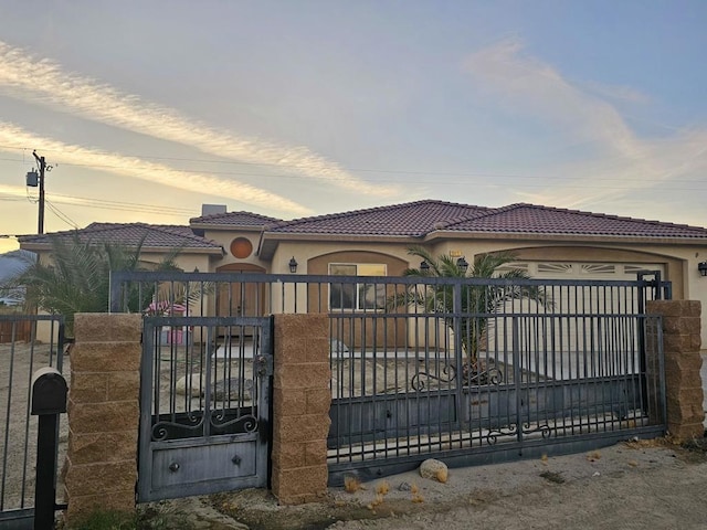 view of gate at dusk