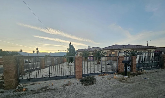 view of gate at dusk