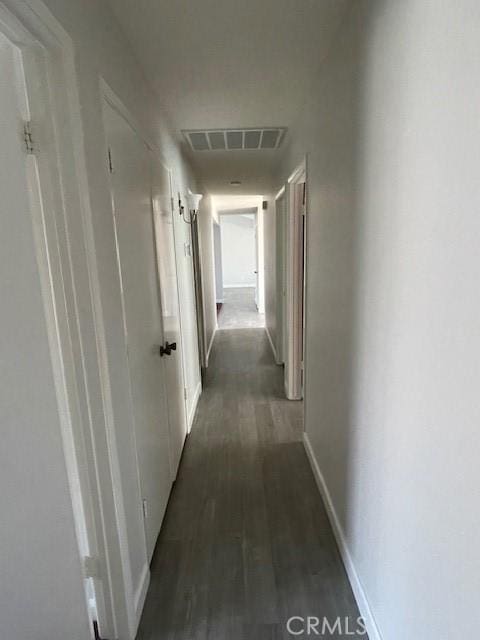 hallway featuring dark hardwood / wood-style floors