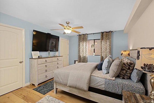 bedroom featuring hardwood / wood-style flooring and ceiling fan