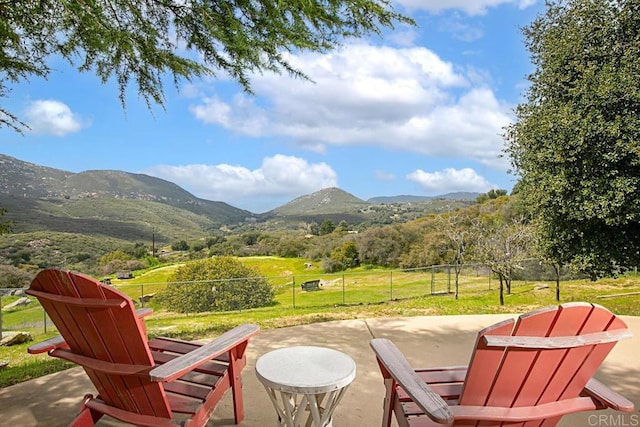 view of patio with a mountain view and a rural view