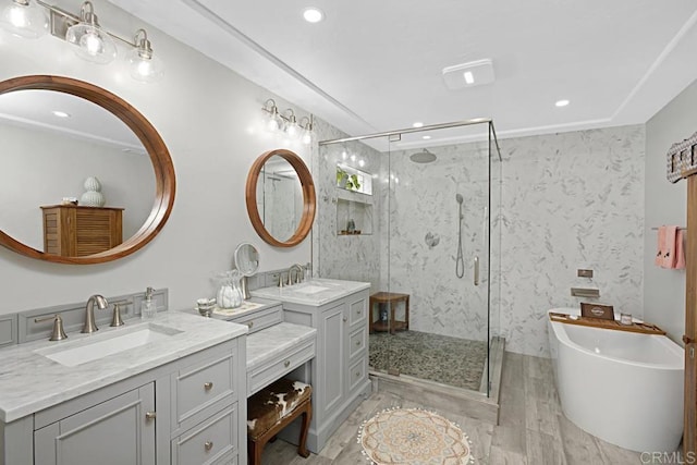 bathroom with vanity and independent shower and bath