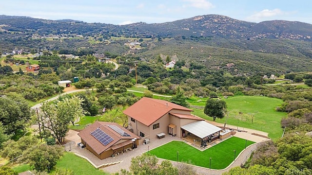 birds eye view of property featuring a mountain view