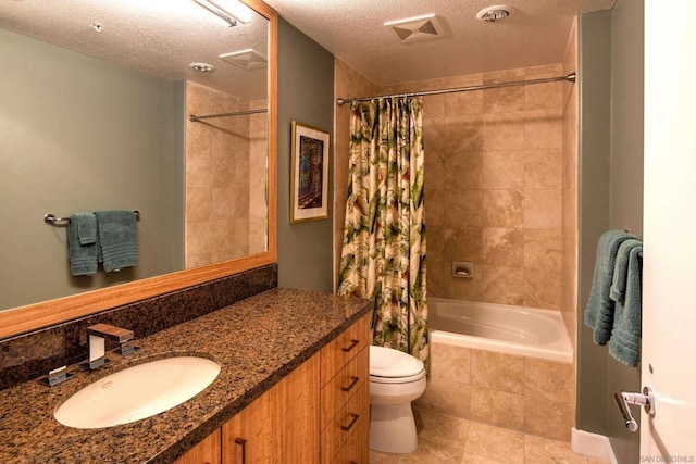 full bathroom featuring toilet, vanity, shower / tub combo with curtain, and a textured ceiling