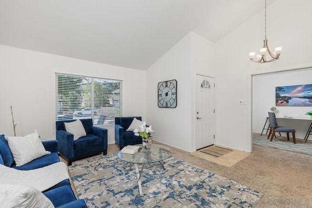 living room with an inviting chandelier, carpet floors, and high vaulted ceiling