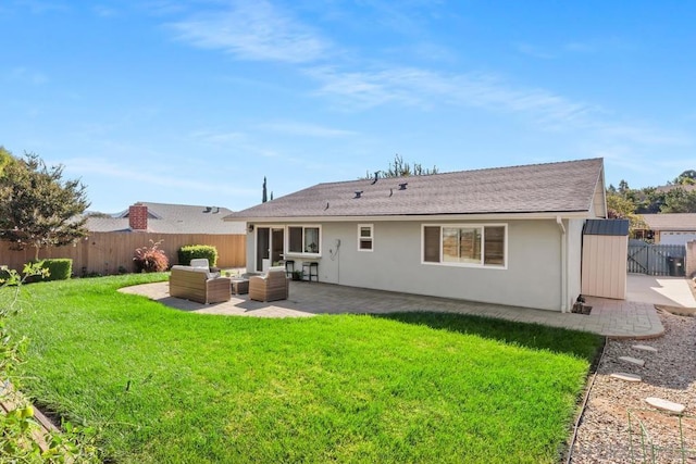 rear view of property featuring a yard, outdoor lounge area, and a patio