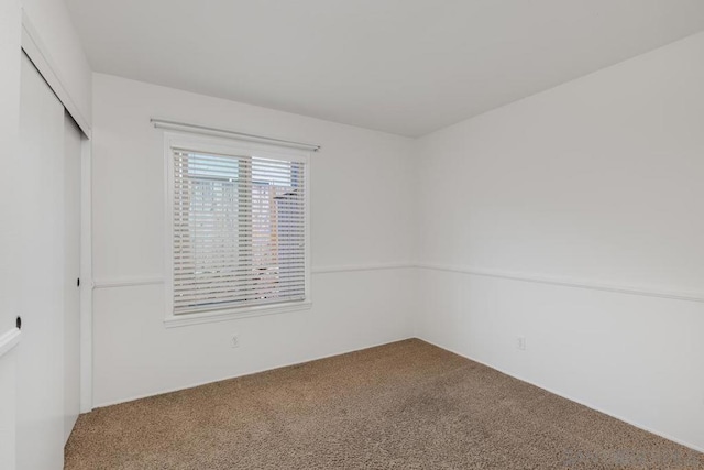 unfurnished room with carpet floors