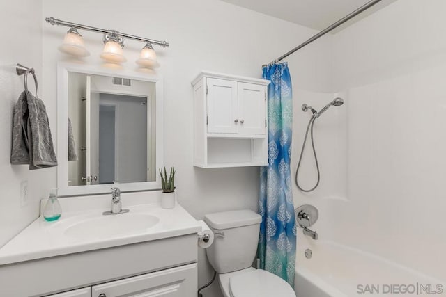 full bathroom with vanity, toilet, and shower / bath combo with shower curtain