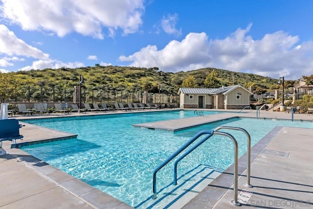 view of swimming pool with a patio area