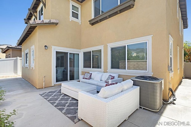 rear view of house with an outdoor hangout area, a patio area, and cooling unit