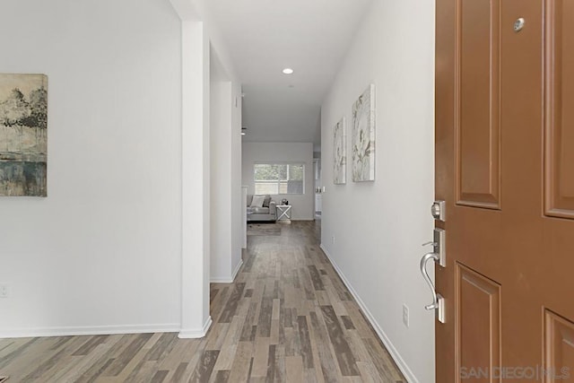 corridor featuring light wood-type flooring