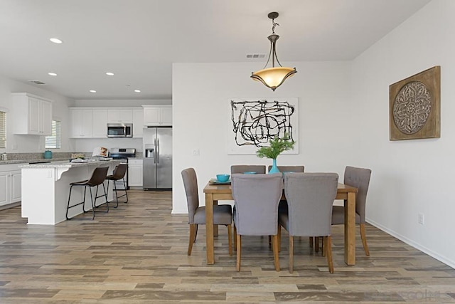 dining room featuring light hardwood / wood-style flooring