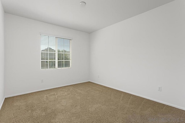 unfurnished room featuring carpet flooring