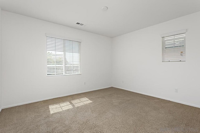 empty room with carpet flooring