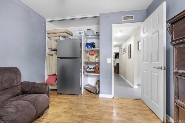 8115 Cacus, Spring Valley, CA 91977 - sitting room with light wood-type flooring and baseboards