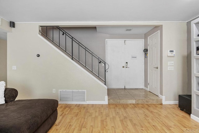 8115 Cacus, Spring Valley, CA 91977 - foyer with wood finished floors, stairway, and crown molding