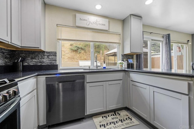 8115 Cacus, Spring Valley, CA 91977 - kitchen with appliances with stainless steel finishes, backsplash, gray cabinetry, dark countertops, and recessed lighting