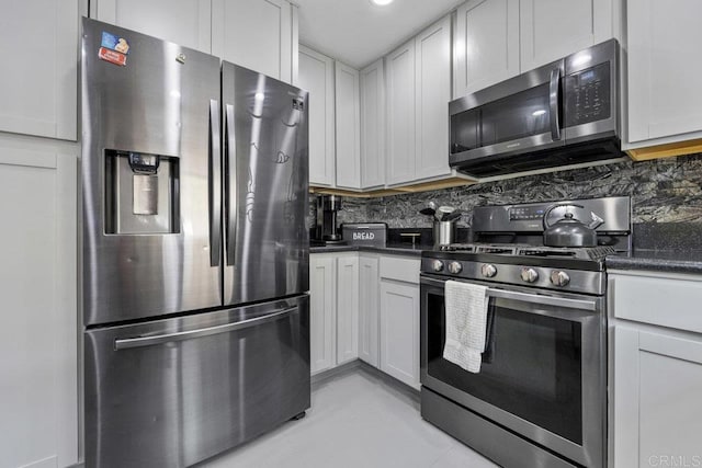 8115 Cacus, Spring Valley, CA 91977 - kitchen featuring stainless steel appliances, tasteful backsplash, dark countertops, and light tile patterned floors