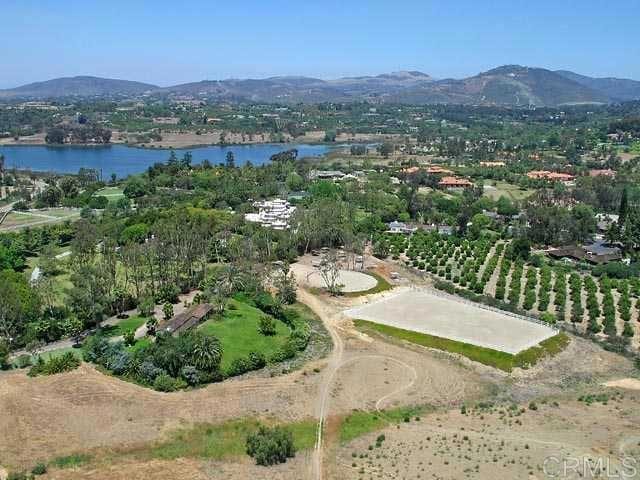 birds eye view of property featuring a water and mountain view