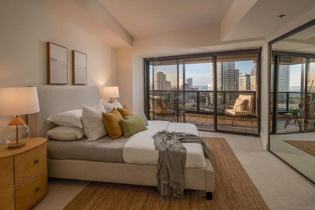 carpeted bedroom featuring access to exterior