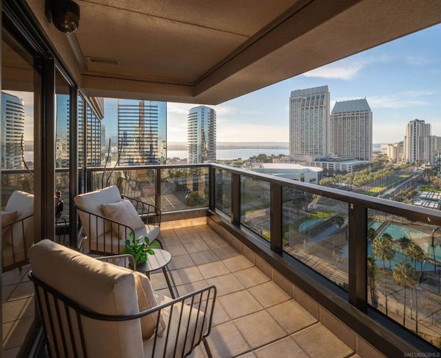 balcony featuring a water view