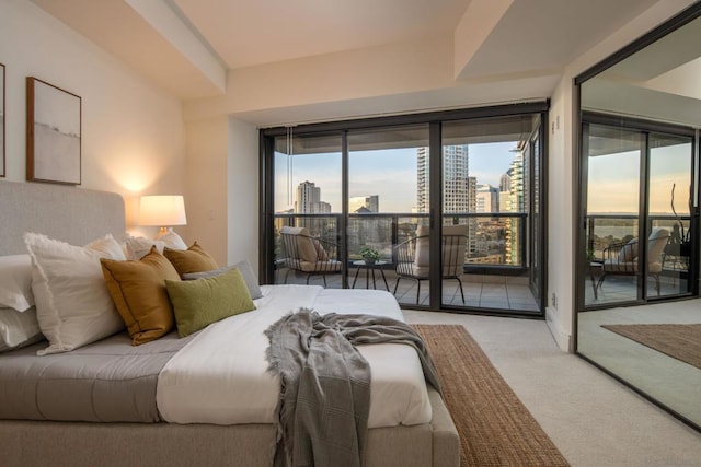 carpeted bedroom featuring access to exterior