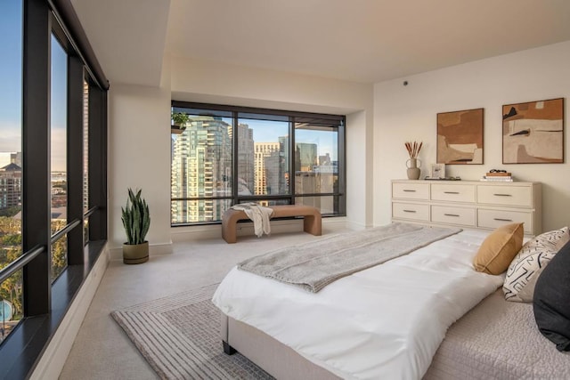 bedroom featuring light colored carpet