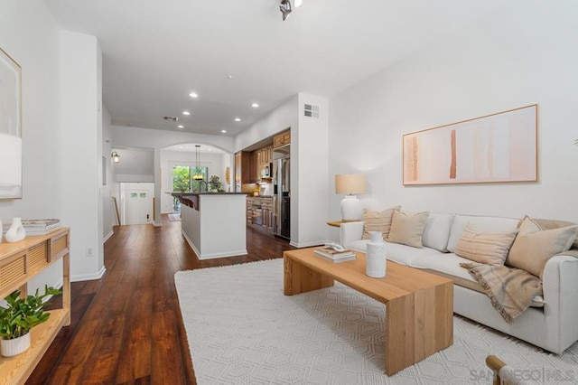 living room featuring dark hardwood / wood-style flooring