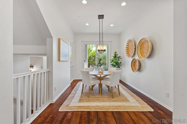 dining space featuring dark wood-type flooring