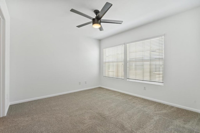 empty room featuring ceiling fan and carpet flooring