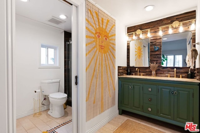 bathroom featuring toilet, tile patterned flooring, backsplash, and vanity