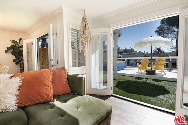 sunroom / solarium featuring french doors