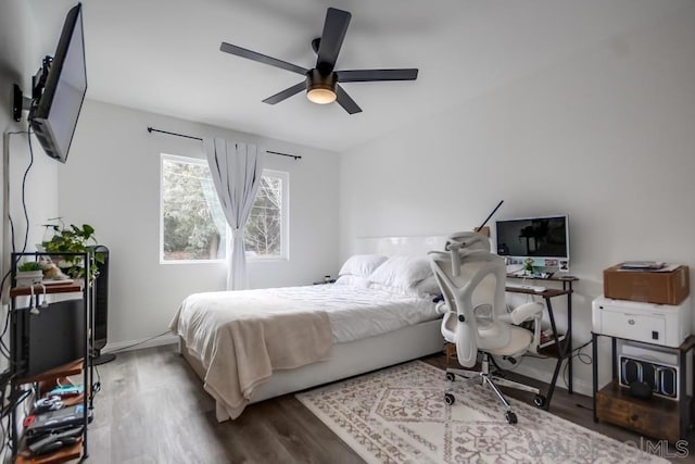 bedroom featuring ceiling fan and hardwood / wood-style flooring