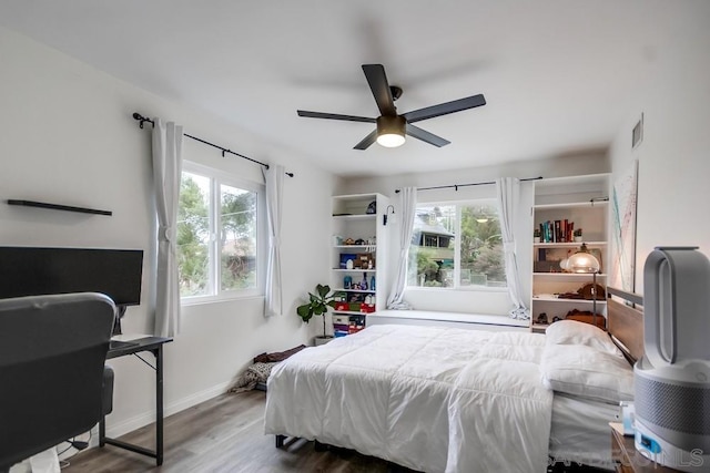 bedroom featuring ceiling fan and hardwood / wood-style flooring