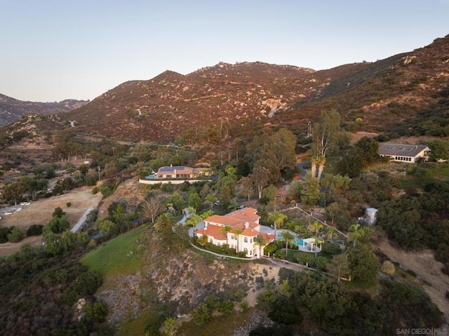 drone / aerial view featuring a mountain view