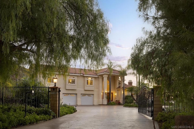 mediterranean / spanish-style house featuring a garage