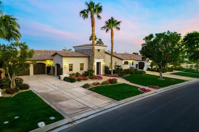 mediterranean / spanish house with a yard