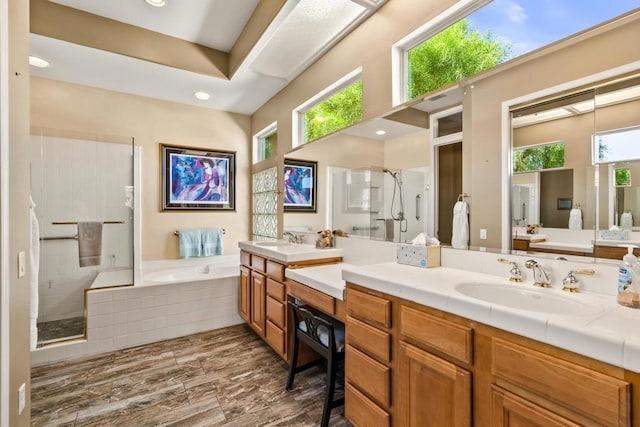 bathroom with plus walk in shower and vanity