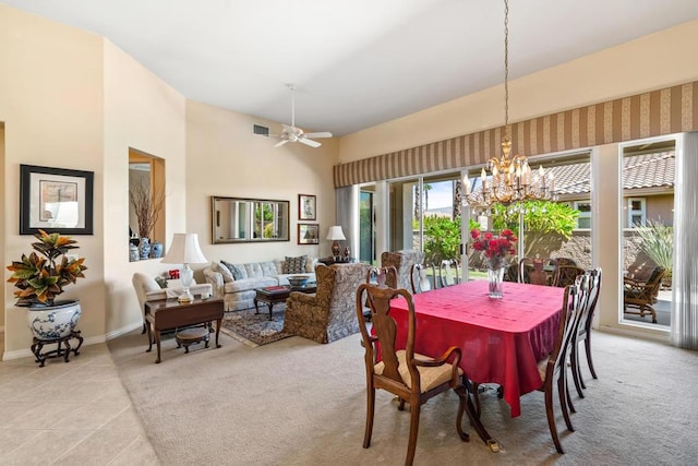 dining area with light carpet and ceiling fan with notable chandelier