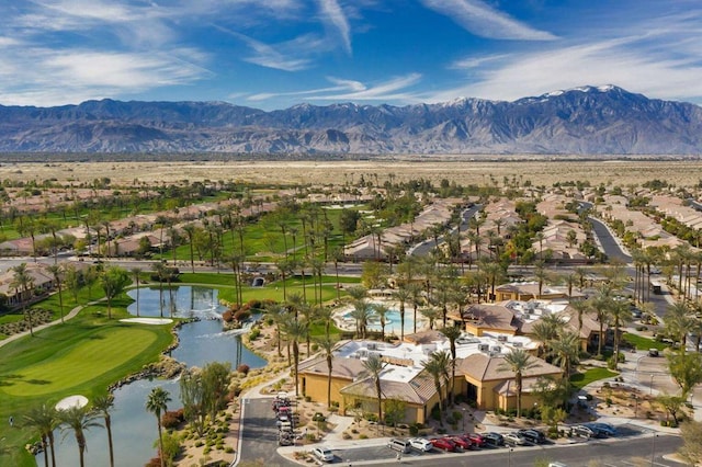 drone / aerial view with a water and mountain view