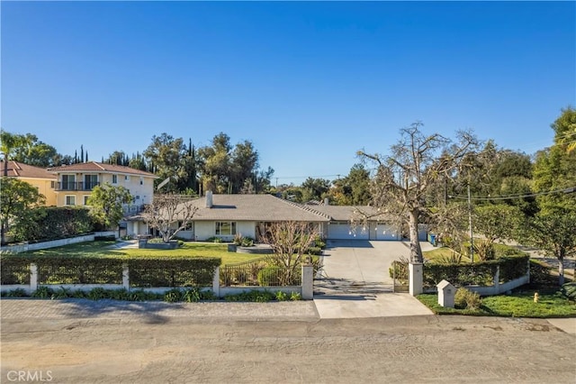 view of front of property with a front lawn and a garage