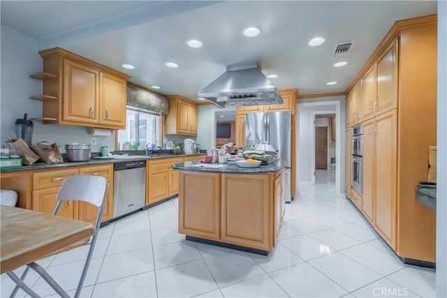 kitchen with island exhaust hood, stainless steel appliances, light tile patterned flooring, and a center island