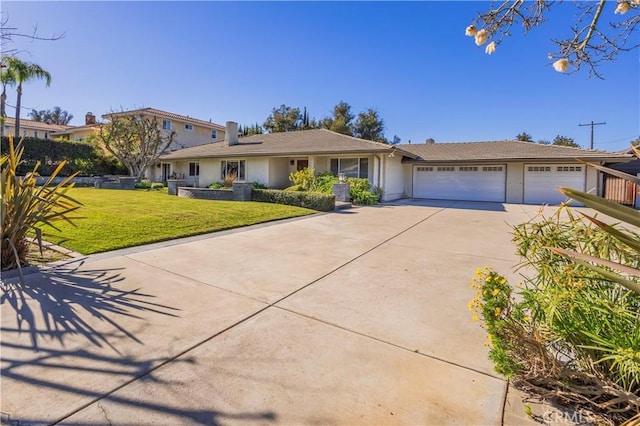 single story home with a garage and a front lawn