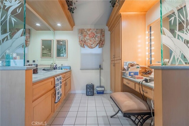 bathroom featuring tile patterned flooring and sink